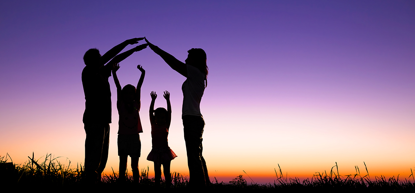 Silhouette of family at sunset