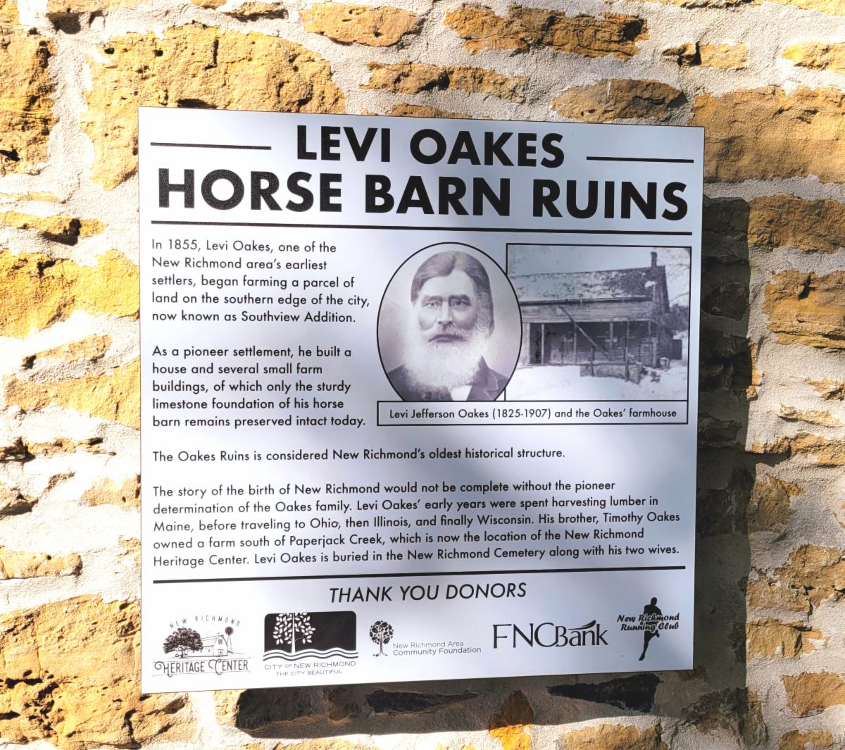 A sign describing Levi Oakes Horse Barn Ruins