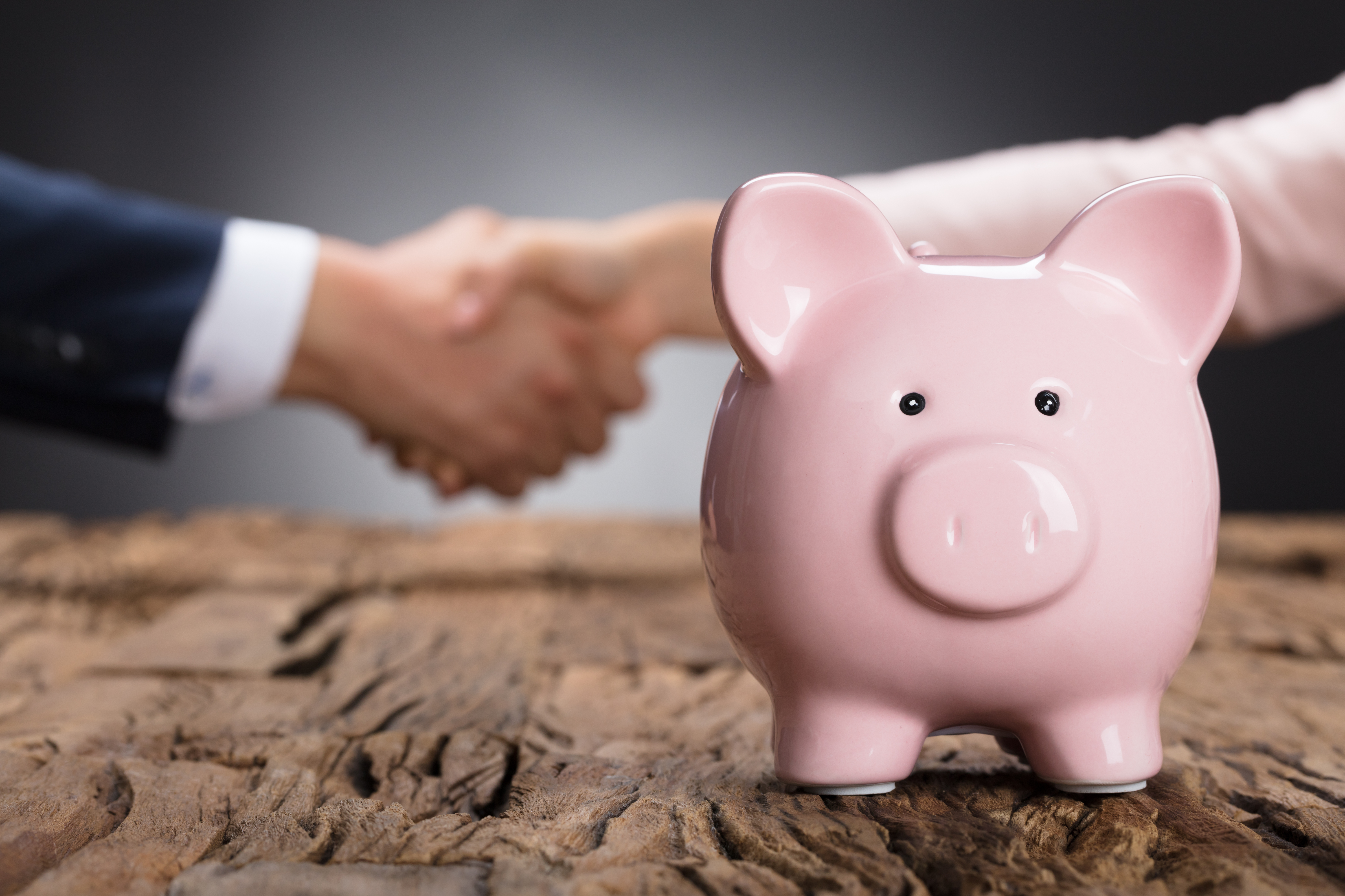 Piggy bank handshake